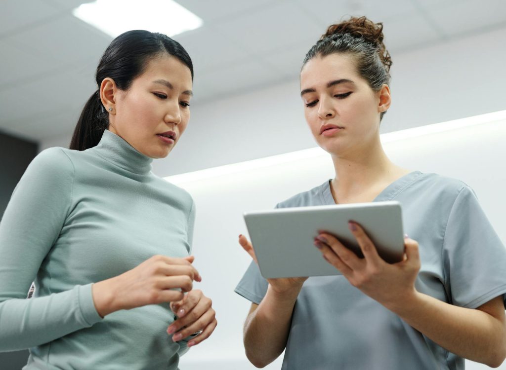 A Woman Consulting with a Doctor